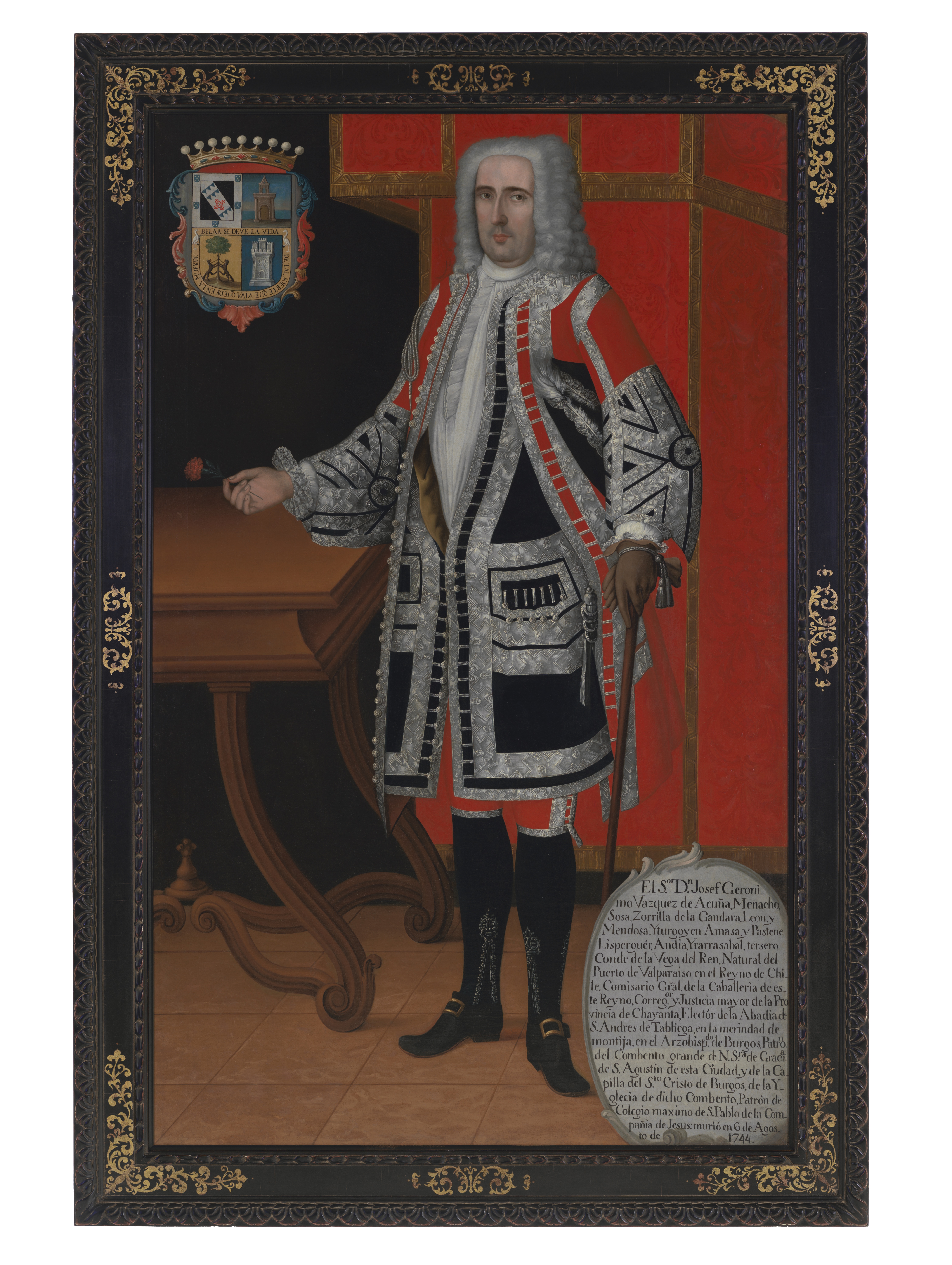 A painting depicting a man in an opulent set of clothes standing at a table with a red drape behind him. His coat of arms is in the top left corner while a cartouche of his biography is at the bottom right.