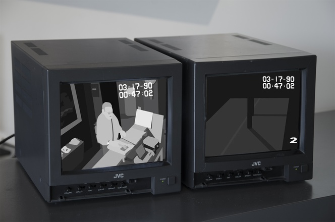 Two-channel digital video animation on vintage monitors replicates actual security footage from the 1990 Isabella Stewart Gardner Museum artwork theft in which works by Rembrandt, Degas, and Manet were stolen.