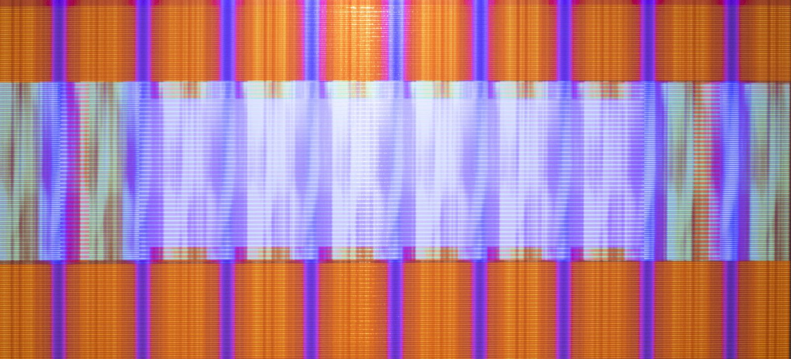 Like an animated painting, Electr-O-Pura projects a digital animation atop a painted aluminum panel to produce a colorful geometric abstraction in motion. When the digital animation is turned off, the hard-edge painting exists independently in its frozen state. When turned on, the digital projection is designed to visually interact with its painted substrate, initiating a live optical illusion.