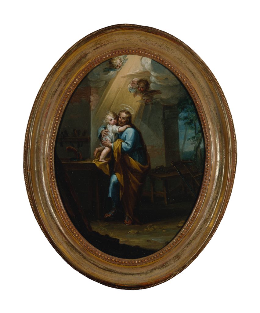 A painting depicting Saint Joseph holding the Christ Child.