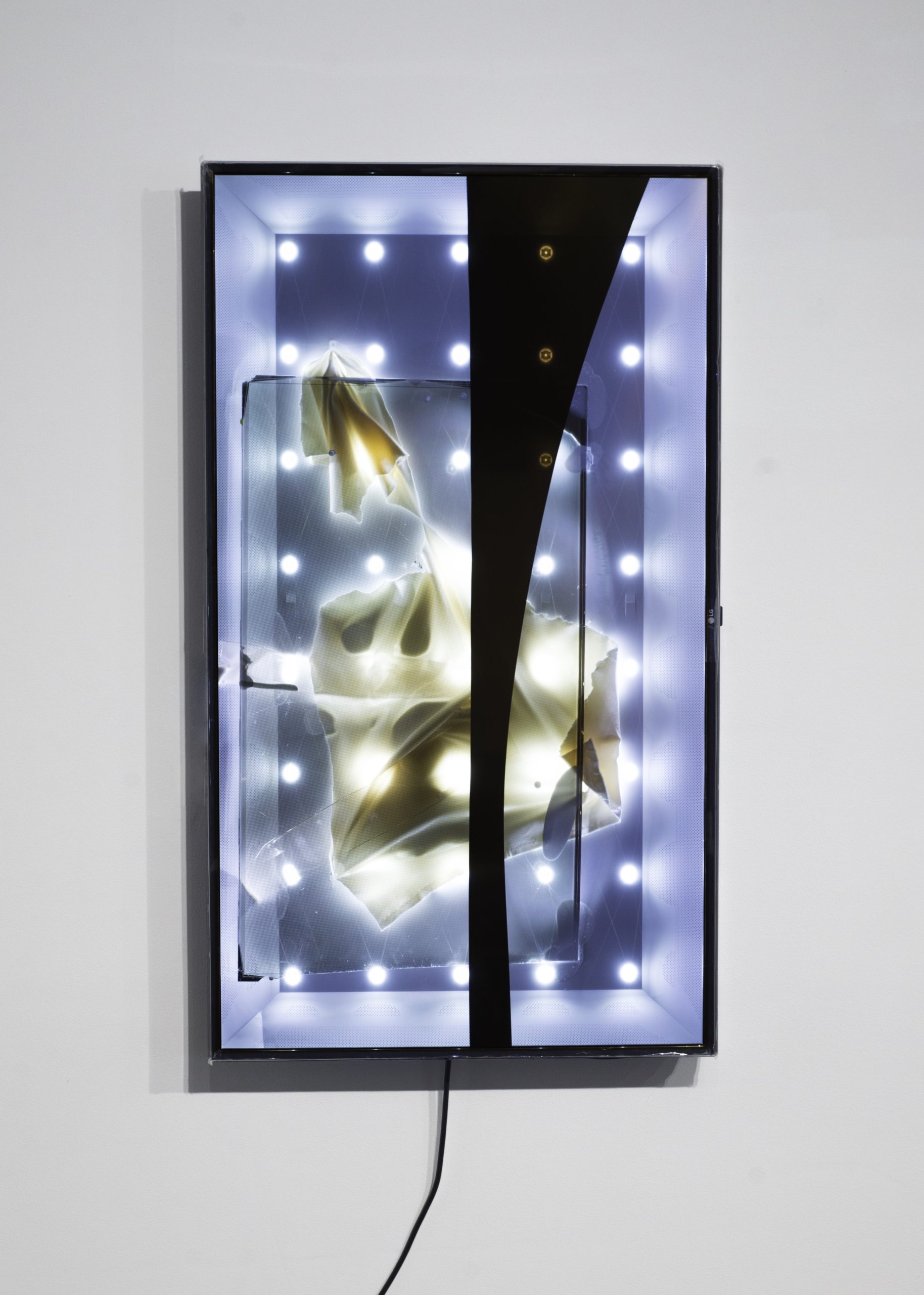 Light filters were peeled from a TV's screen to expose an interior space which the artist fills with found object collage, as an animated video plays on the transparent glass.
