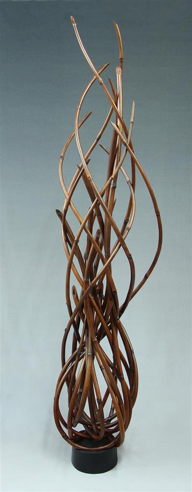 Vertical bamboo sculpture depicting fire
