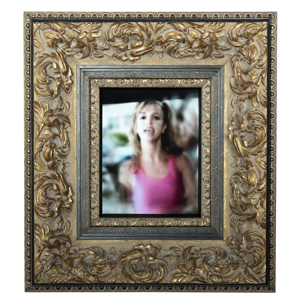 Video monitor depicting Britney Spears framed ornately